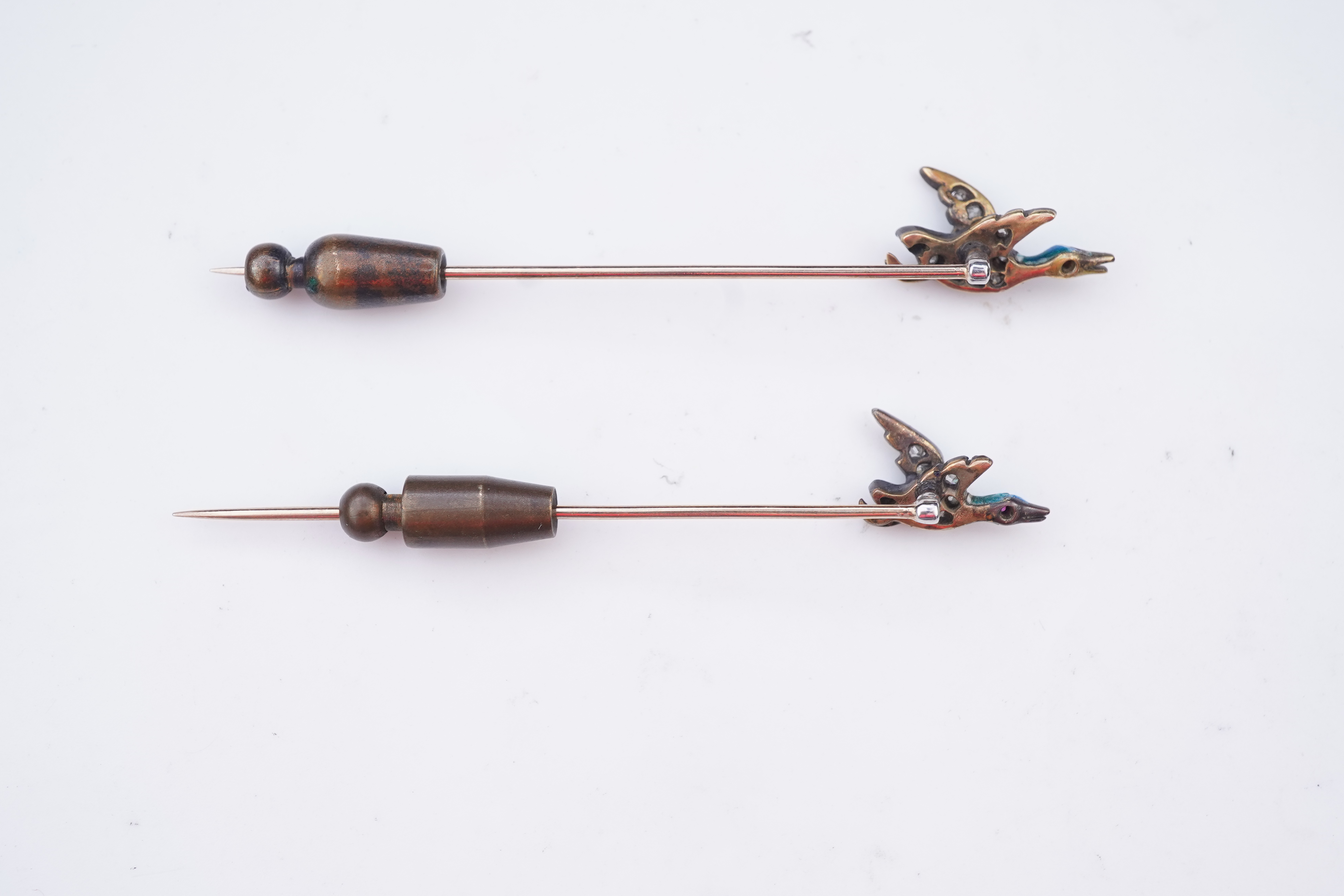 A pair of novelty enamel and diamond stick pins, circa 1900